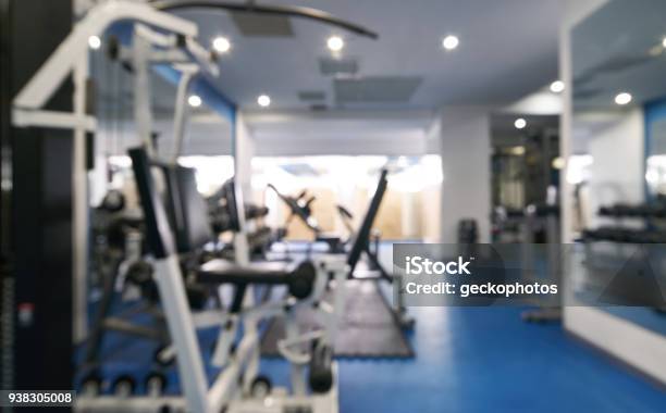 Abstract Blurred Of Fitness Gym Interior With Exercise Equipment Stock Photo - Download Image Now