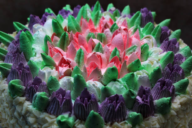 colorful cake decorated with strawberries and blueberries placed on a tray on colorful background. Happy Birthday