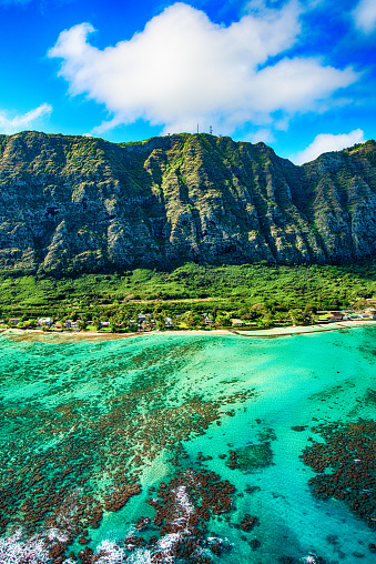 The beautiful and unique landscape of coastal Oahu, Hawaii shot from an altitude of about 1000 feet over the Pacific Ocean.