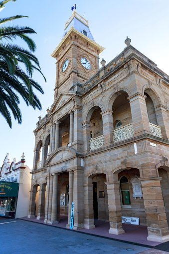 View of the Town Hall and clock tower, designed by Willoughby Powell and built in 1888 from sandstone to last, in Warwick, Queensland, Australia.