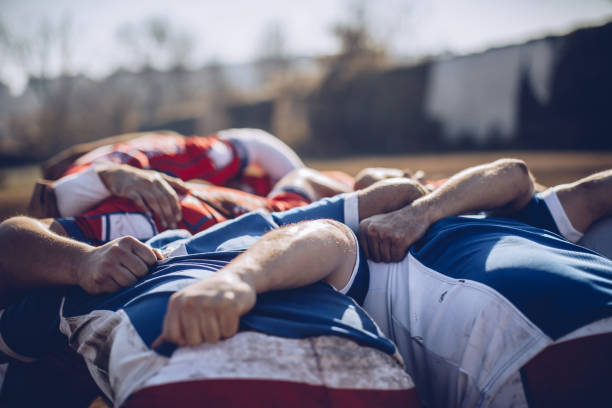 istock Rugby players embracing 938320288