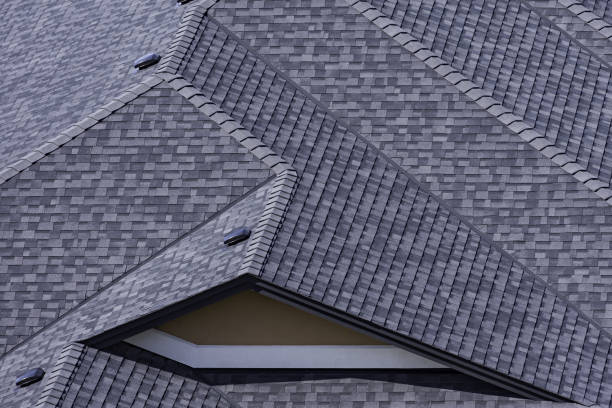istock Rooftop in a newly constructed subdivision showing asphalt shingles 938323100