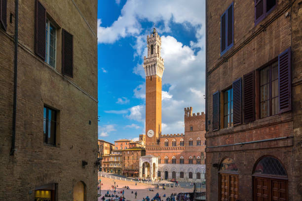 istock Crowd of people in Piazza del Campo square in Siena 938325884