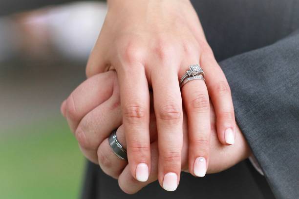 istock Hands of the bride and groom 938330250