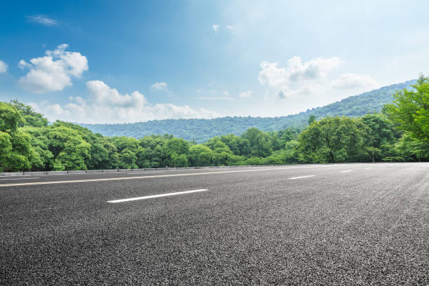 istock asphalt road and green forest with mountain landscape 938330936