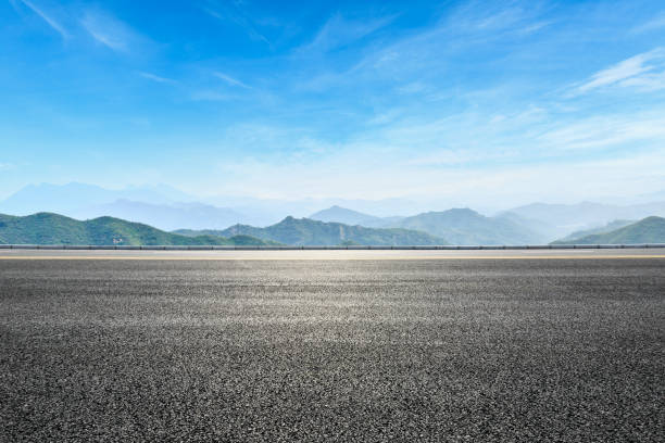 istock asphalt highway and hill landscape under the blue sky 938333272