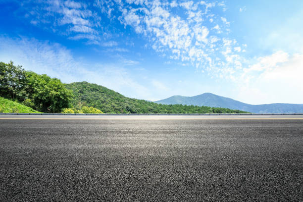 istock asphalt road and green forest with mountain landscape 938336108