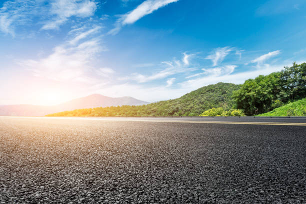 istock asphalt road and green forest with mountain landscape 938336112