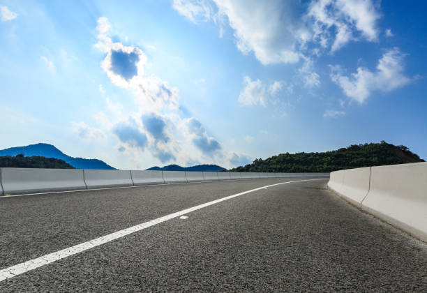 istock asphalt road and hill landscape under the blue sky 938336556