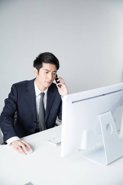istock stressed businessman on phone 938340488
