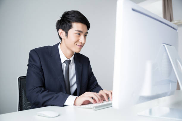 istock young asian businessman working in office 938340652