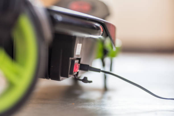 istock Closeup day view electric scooter charging up 938345254