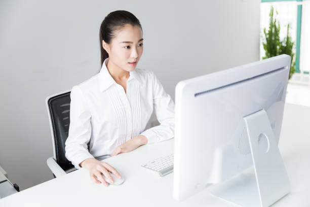istock young asian businesswoman working in office 938345364