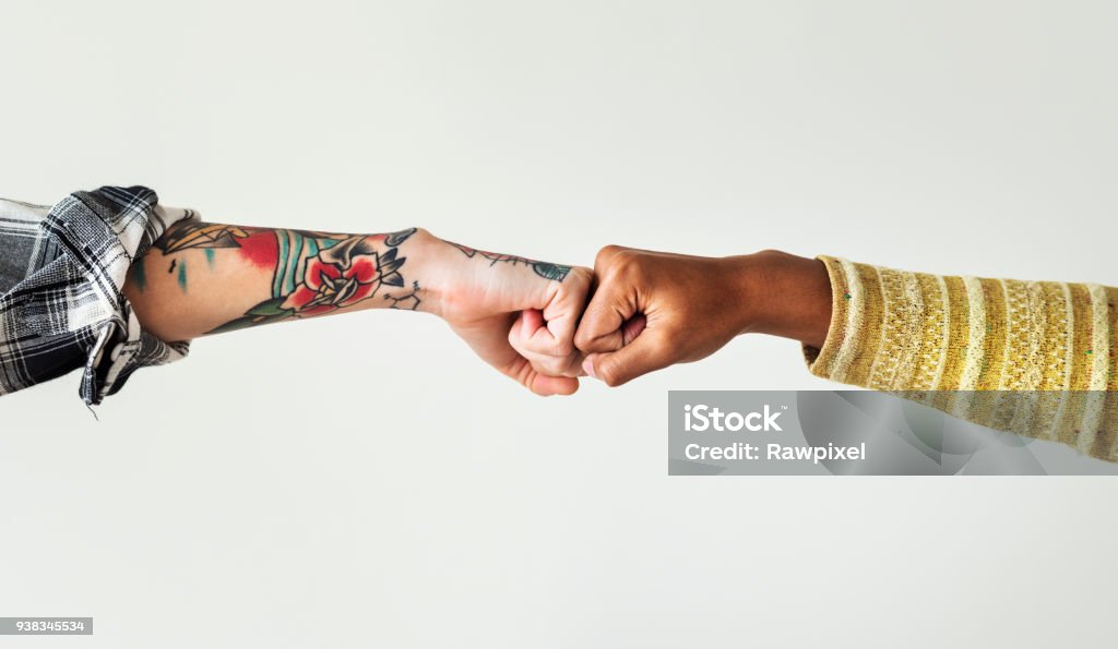 People bumping their fists together Fist Bump Stock Photo