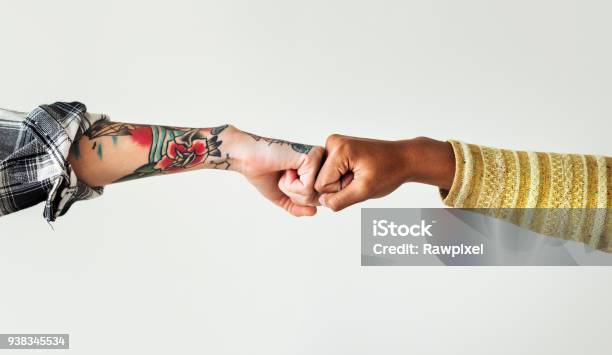 People Bumping Their Fists Together Stock Photo - Download Image Now - Fist Bump, Hand, Handshake
