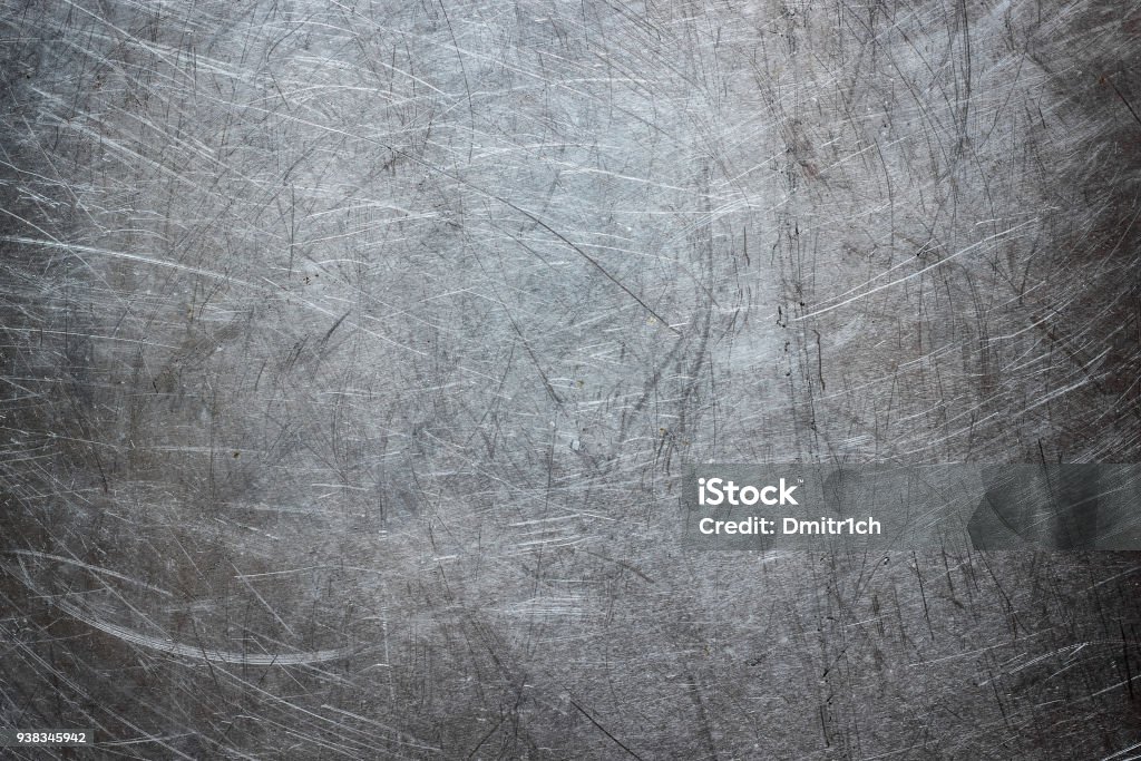 Grunge background of stainless steel, metal texture closeup Texture of stainless steel wallpaper, background of metal with scuffs Metal Stock Photo