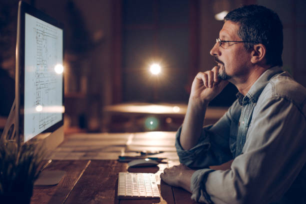 istock Mid adult man in office 938352360