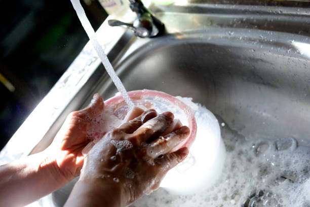 washing hand and dish in the kitchen in the morning