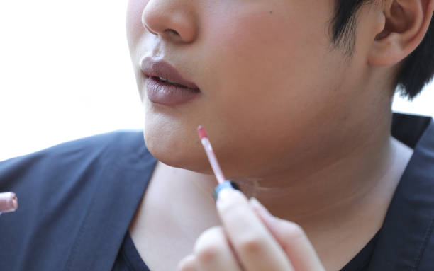 istock man's Mouth with light brown Lipstick on his Chubby Lips 938365332