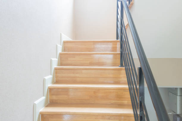 istock Staircase, wooden floor and black iron rail. 938368518