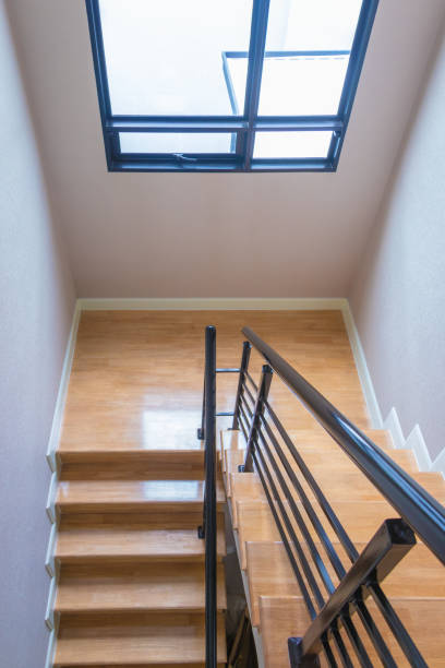 istock Staircase, wooden floor and black iron rail. 938368532
