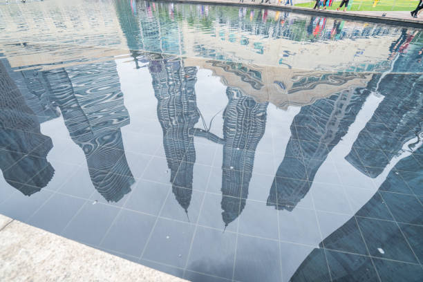 istock Reflection of Kuala Lumpur skyline, buildings, low angle 938369420