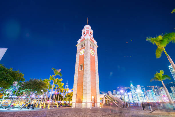 istock The Clock Tower is a landmark in Tsim Sha Tsui at twilight 938371896