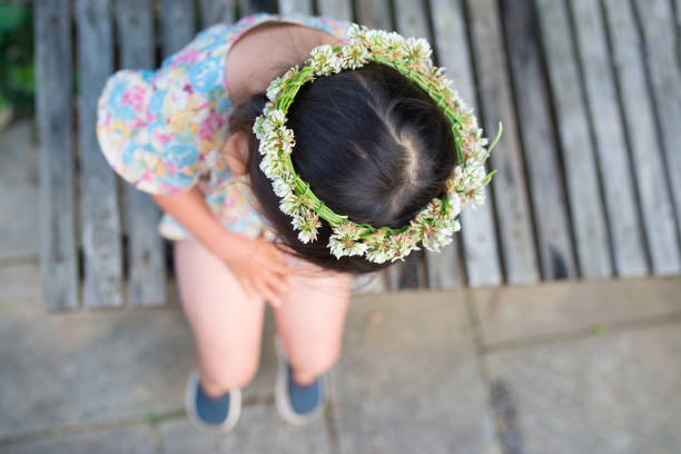 Little girl wearing flower tiara