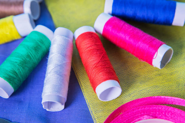 istock Colorful yarns with pink ribbon 938382332