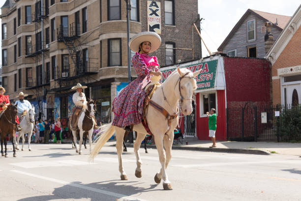 Graeagle, California, USA- July 5, 2015: Children riding seesaw  rocking horses and waving flags as they move up the parade route during the Mohawk Valley Independence Day Celebration.