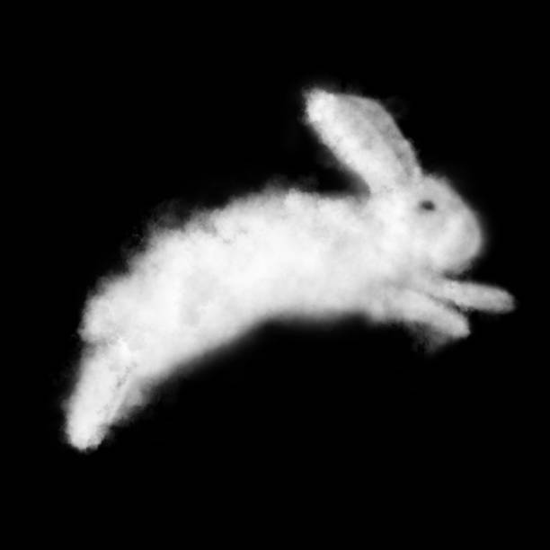Easter bunny made from a cloud presented on a black background stock photo