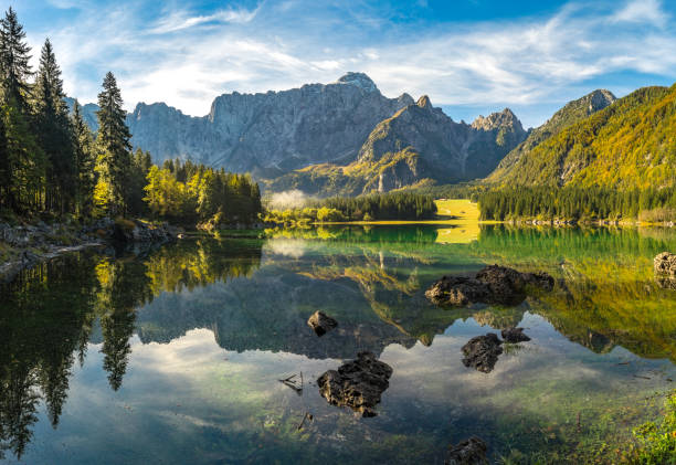 Panorama of a mountain lake in the Julian Alps in Italy - Laghi di fusine Panorama of a mountain lake in the Julian Alps in Italy - Laghi di fusine julian california stock pictures, royalty-free photos & images