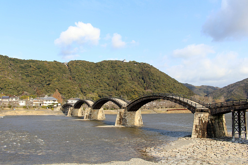 On the way to the iconic Kintai Bridge made of wood. On top of the hill is the Iwakuni Castle. Taken in Yamaguchi Prefecture, February 2018.\