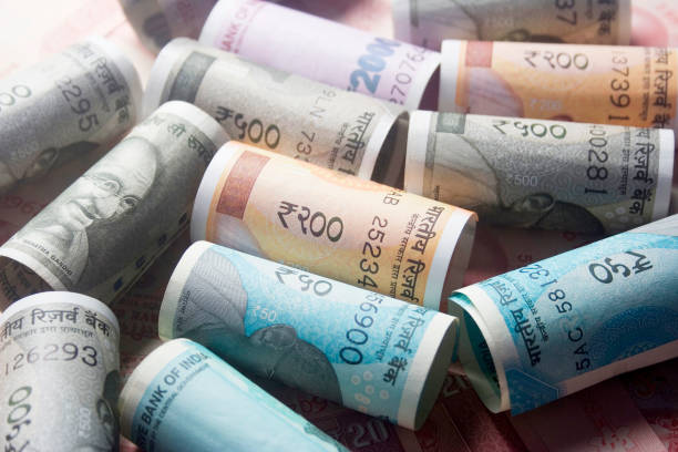 istock 2000 rupee, Indian 200 Rs Currency notes rolled with rubber bands 938396246