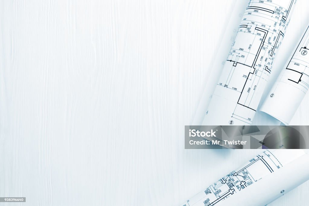 rolls of architectural plans and blueprints on architect workspace rolls of architectural plans and blueprints on architect workspace, top view Blueprint Stock Photo