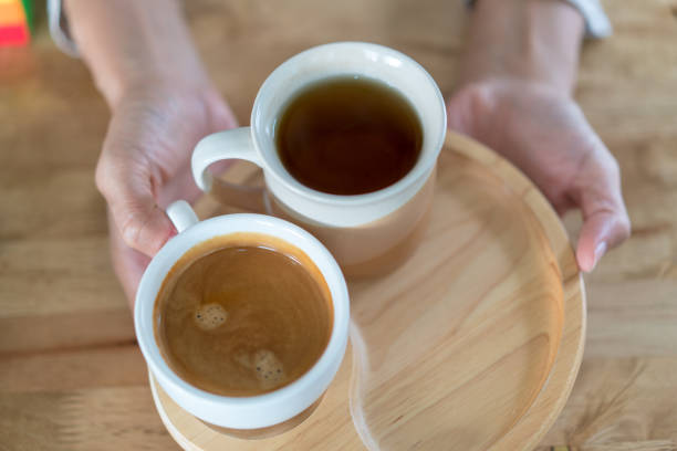 istock Hot coffee cup on wooden table 938397350