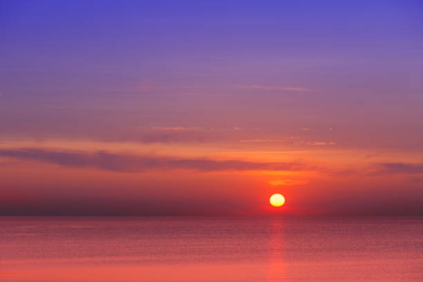 istock eautiful red-purple sunset at sea. Evening calm. 938399634