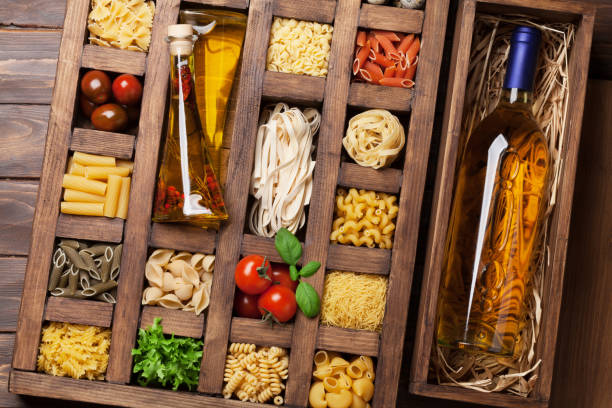 istock Various pasta in wooden box and wine 938401428