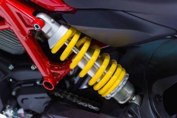 yellow Shock Absorbers of Motorcycle for absorbing jolts stock photo