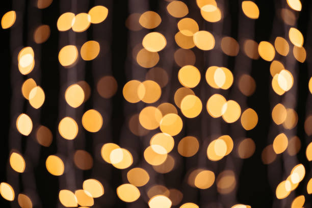 istock abstract shining golden bokeh background 938418720
