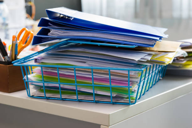 istock file folder and Stack of business report paper file 938422390