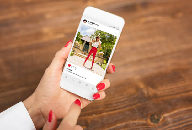 istock Woman looking at publicly shared photo on social network 938423324