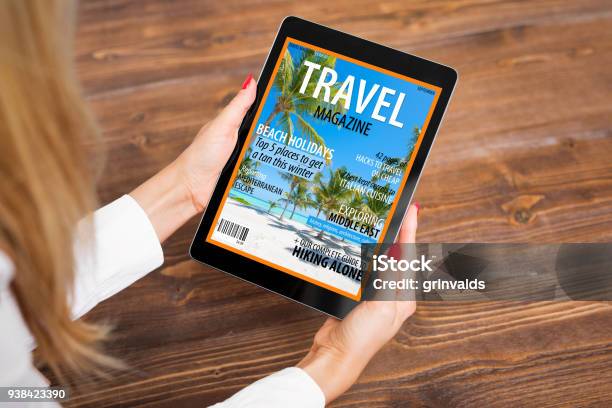 Woman Reading Travel Magazine On Tablet Stock Photo - Download Image Now - Magazine - Publication, Travel, Digital Display