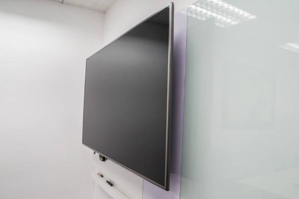 istock close up LED big Internet television screen with whiteboard in boardroom 938426398
