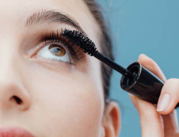 istock Woman applying mascara on her lashes 938427448