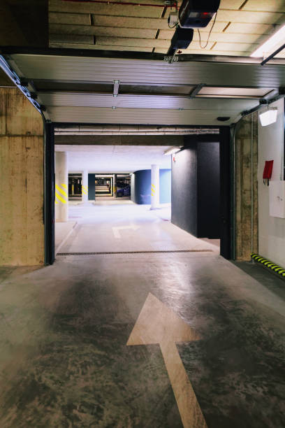 istock Underground Parking garage at modern apartment building 938430648
