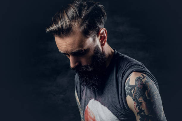 istock Bearded hipster male with tattoos on arms. 938436688