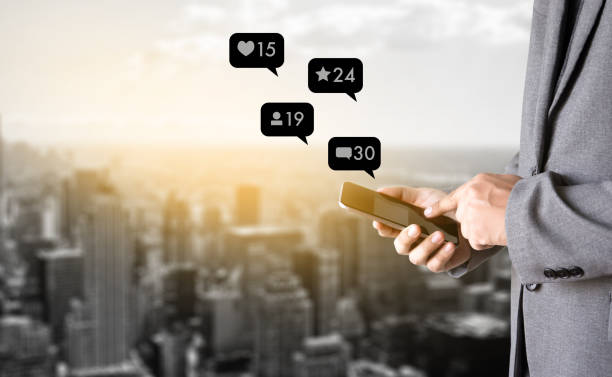 istock sms media man use  smart phone social media network pop notification icons 938437610