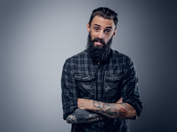 istock Bearded male with tattoos on his arms. 938438140