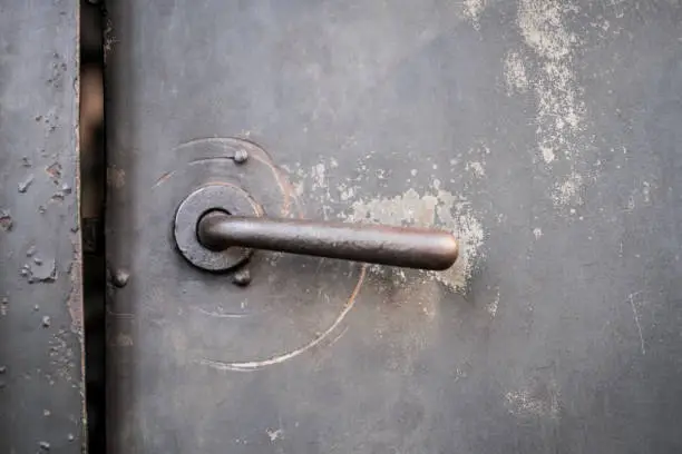Photo of old metal door, iron door, vintage door handle